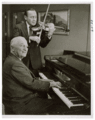 President Truman playing piano while Jack Benny plays the violin, September 3, 1959.