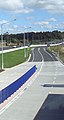 Akoranga station with central pedestrian fence, looking north along busway