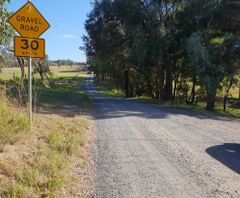 Typical Australian signed "gravel" road, surface=compacted still applies.