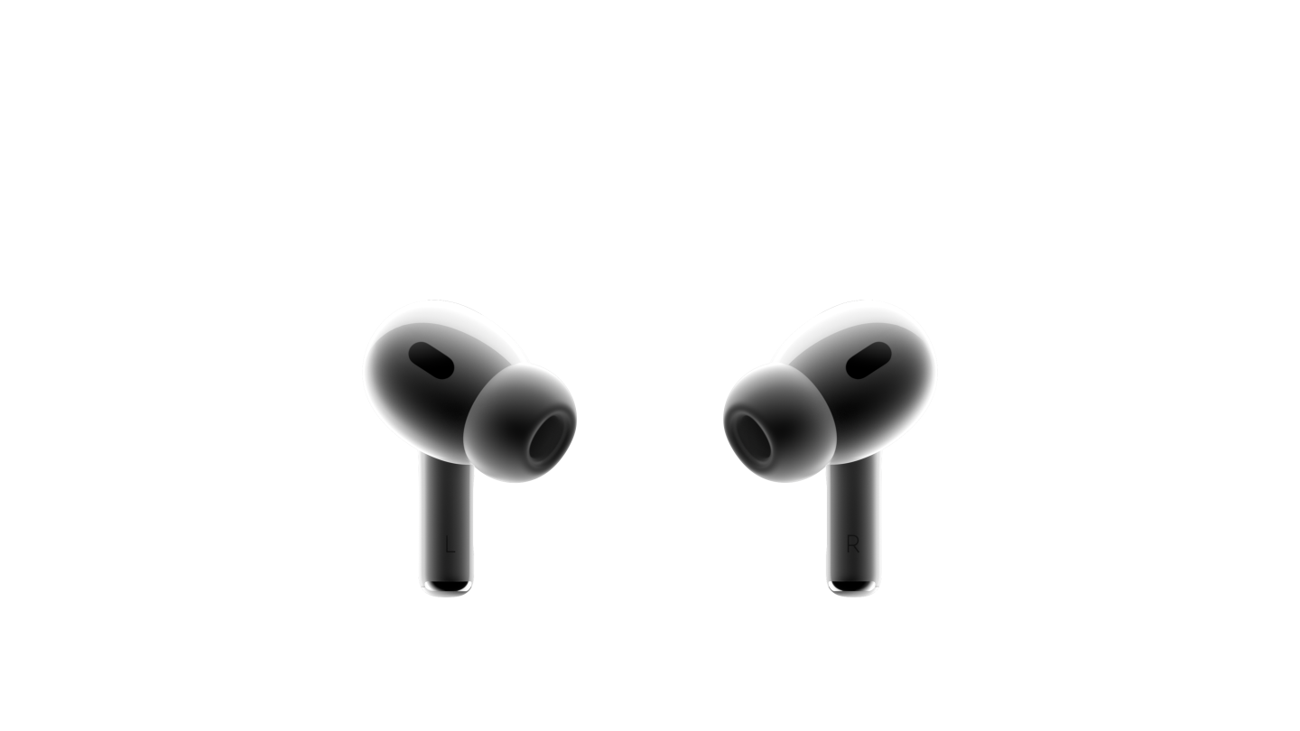 Dvě bílá sluchátka AirPods Pro naproti sobě. Na kompaktních sluchátkách s černou síťovinou jsou nasazené silikonové špunty.