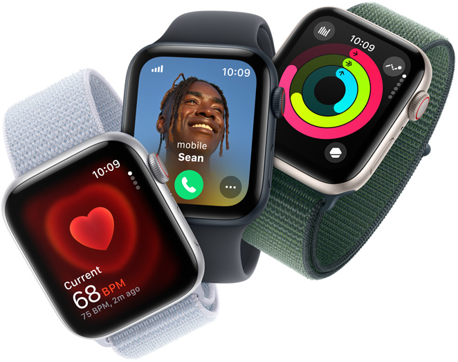 Three Apple Watch SE devices showing heart rate monitoring, an incoming call and Activity rings