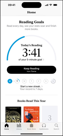 iPhone screen showing the Reading Goals interface in the Books app. At the top, there is a progress ring. Below the progress ring is the weekly reading streak tracker. At the bottom is the Books Read This Year section, which includes a row of two books, with an empty slot for a third.