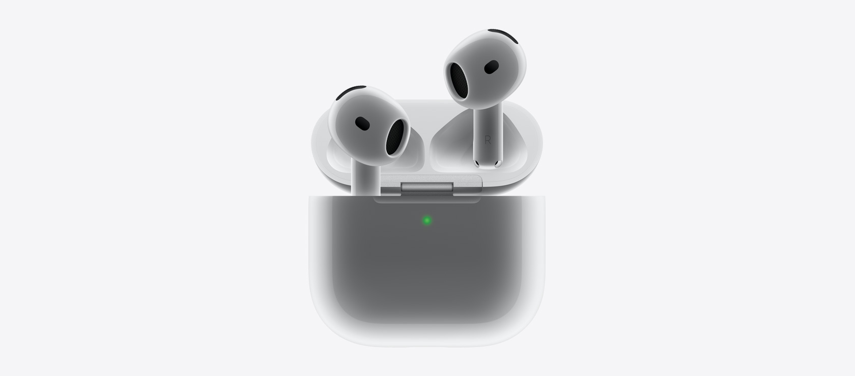 AirPods 4 ‑kuulokkeet, kun ne asetetaan latauskoteloon.