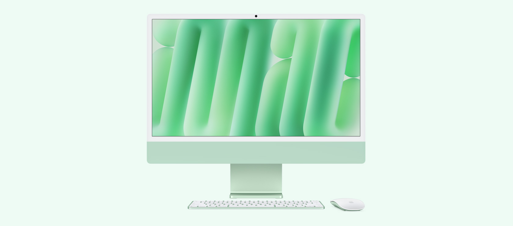 Tampilan depan iMac hijau dengan mouse dan papan ketik berwarna senada