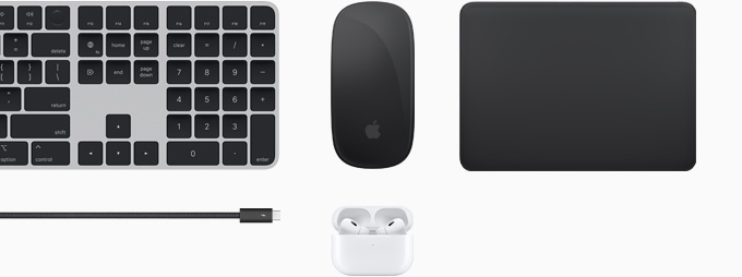 En samling af tilbehør, der omfatter Magic Keyboard, Magic Mouse, Magic Trackpad, et Thunderbolt 4 Pro-kabel og AirPods Pro.