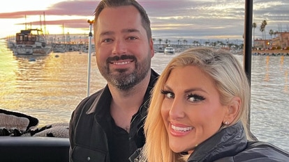 Travis Mullen and Gina Kirschenheiter pose for a photo together.