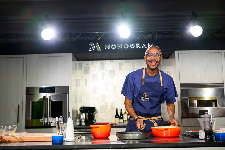 Gregory Gourdet cooking on a panel at FOOD & WINE Classic.