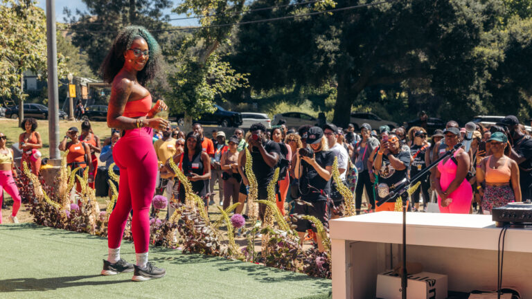 Britteny Floyd-Mayo, aka Trap Yoga Bae, on stage during an event.