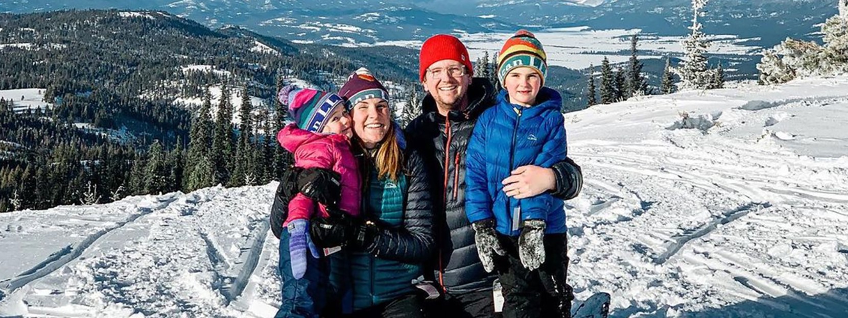 Bowman family gathered outside in the snow