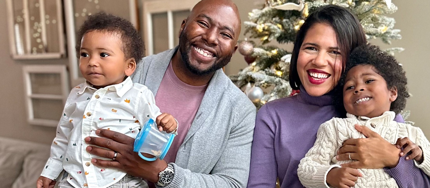 The Brooks family in front of their holiday tree.