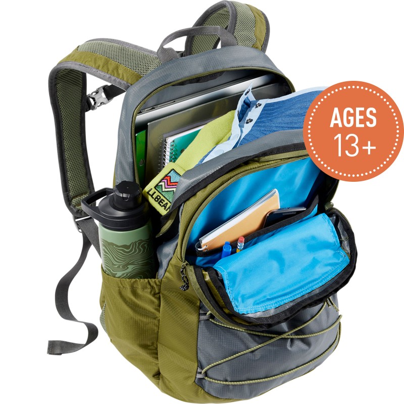 A Comfort Carry Laptop Pack, 30L, open to show contents, a circle with text "Ages 6 ."