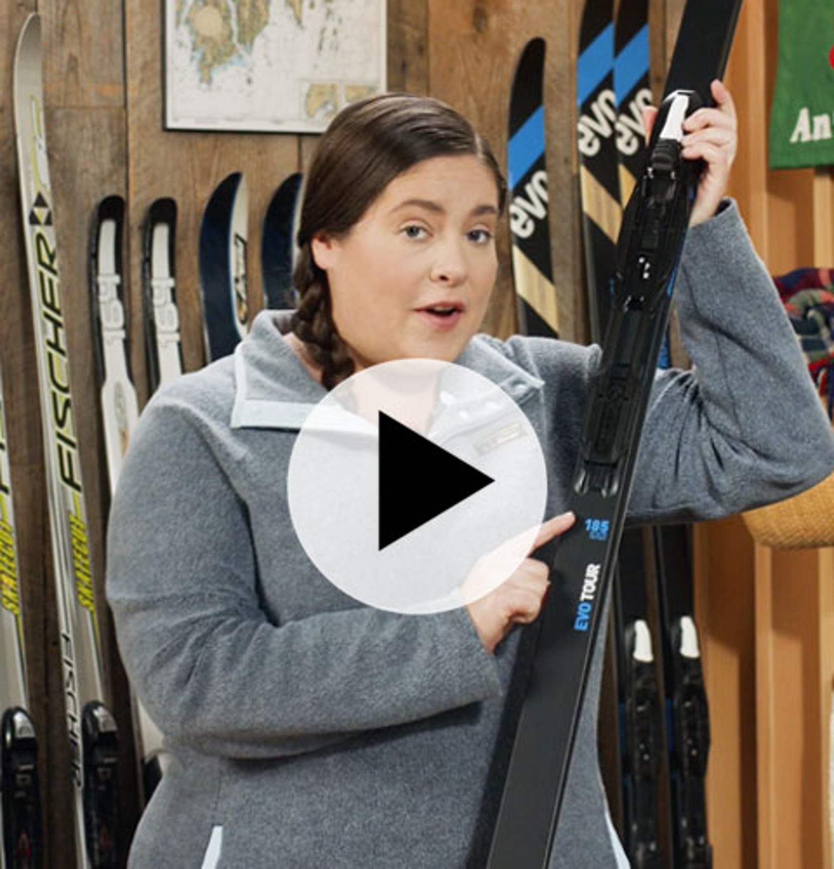 A person holding cross country skis.