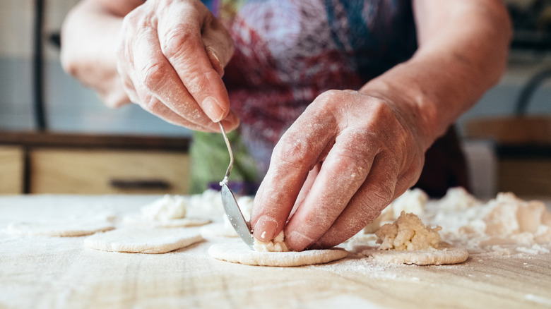 hands of elderly woman cooking