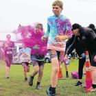 Balclutha Rainbow runners brave the last paint station before the finish line. PHOTO: NICK Brook