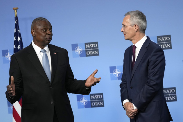 Secretary of Defense Lloyd Austin (left) and NATO Secretary General Jens Stoltenberg chat. 