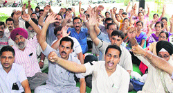 Members of aided schools protest in support of their demands in front of the DC office in Jalandhar on Monday. Photo: Sarabjit singh